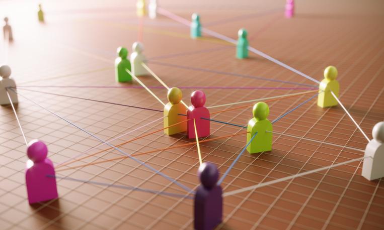 istock image - group of tokens representing people connecting